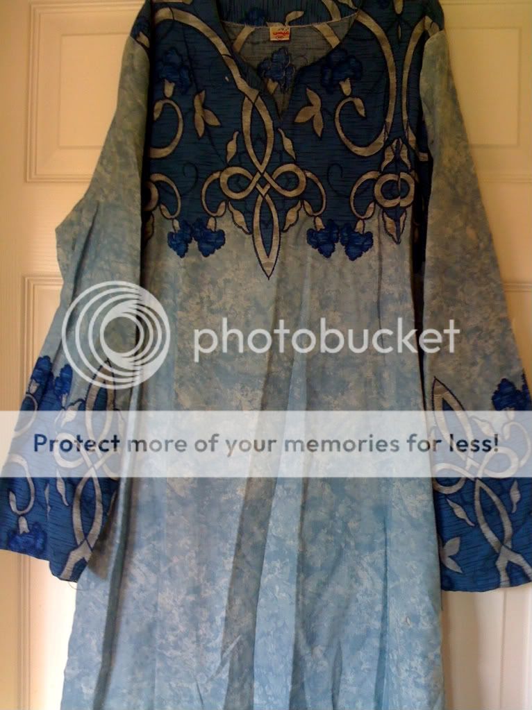   being in storage over all a very beautiful caftan at a great price